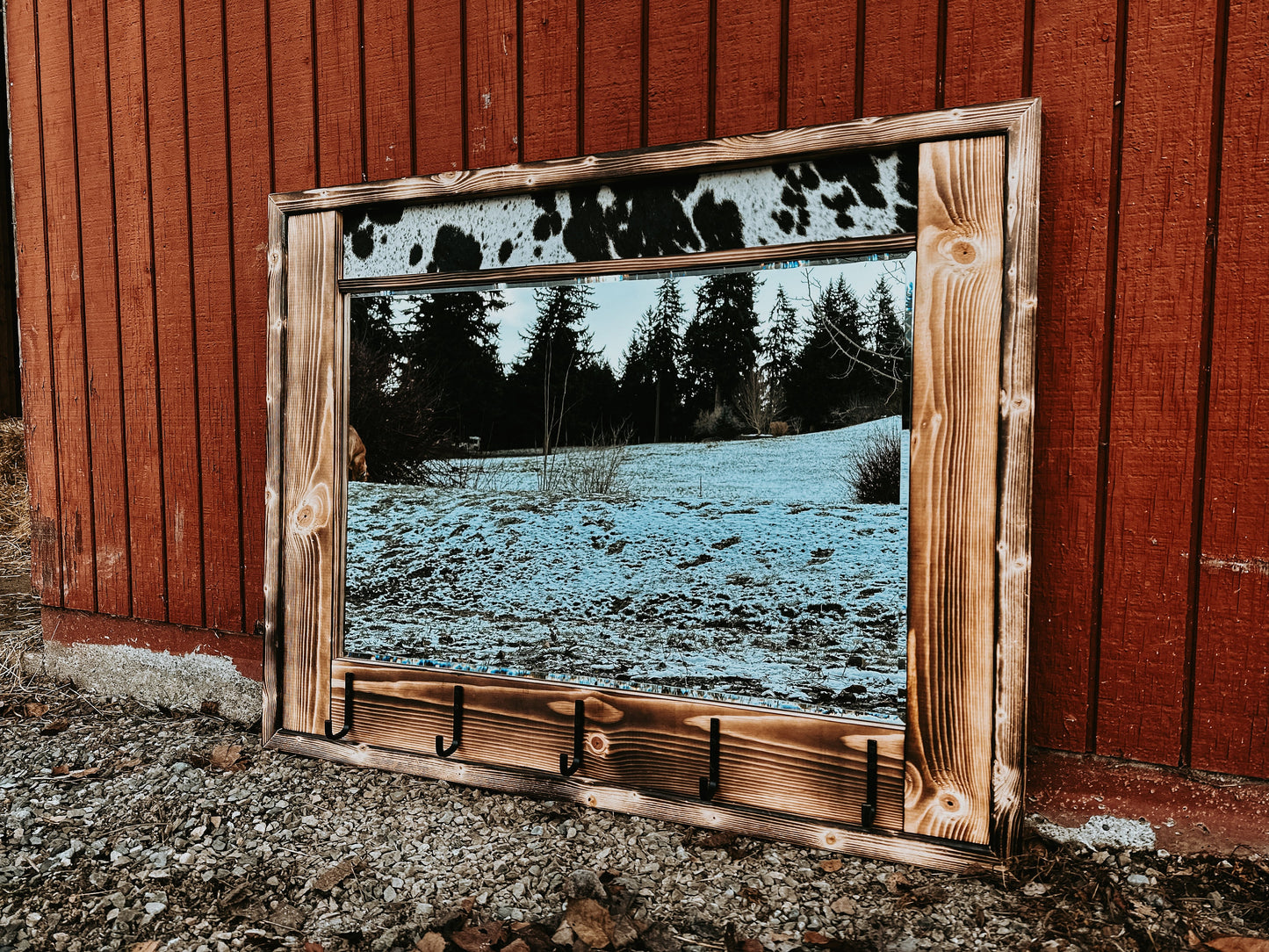 Cowhide framed mirror with hangers
