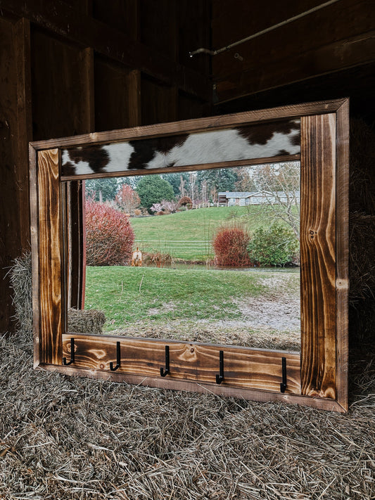 Cowhide framed mirror with hangers