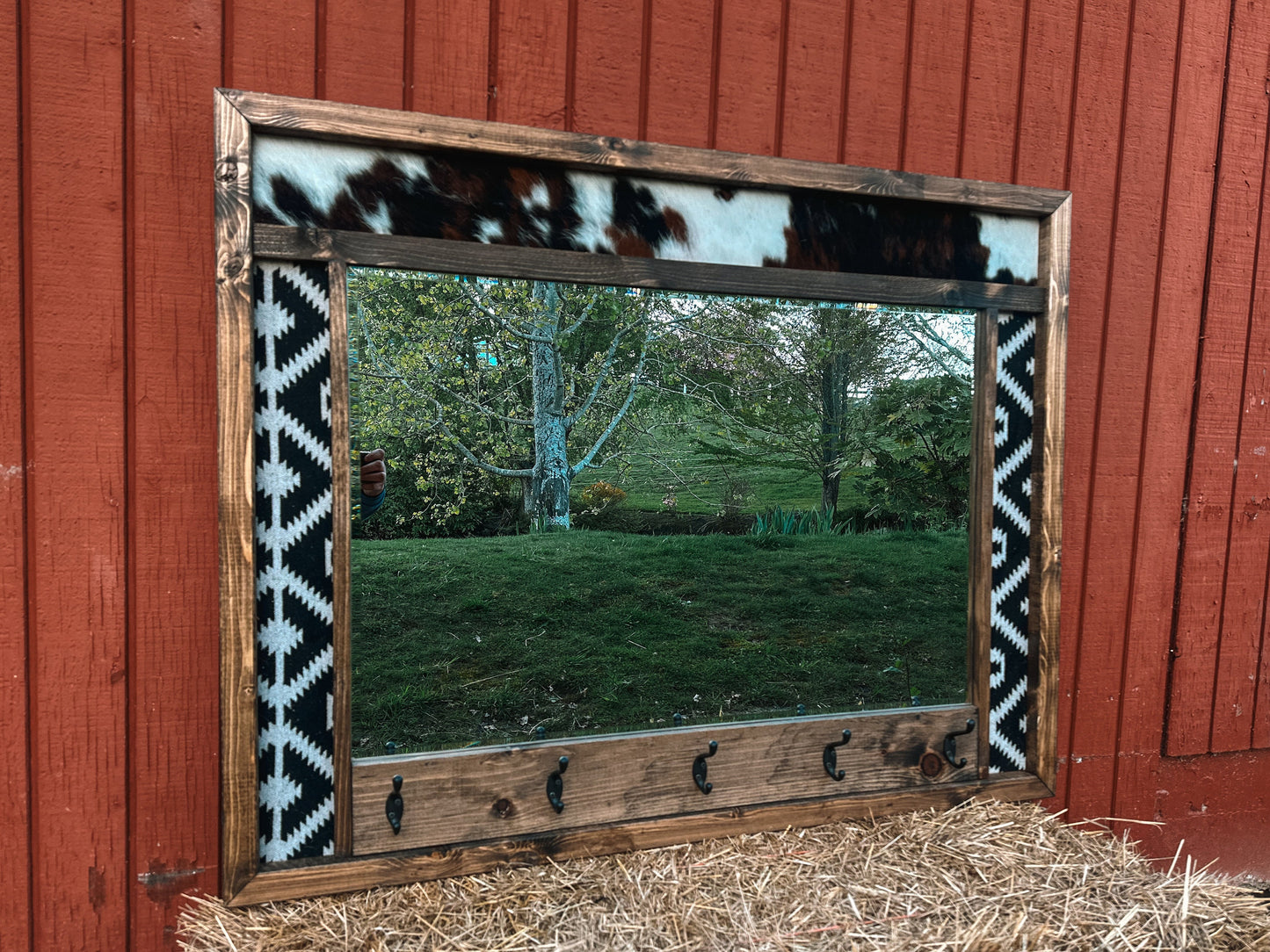 Cowhide framed mirror with hangers