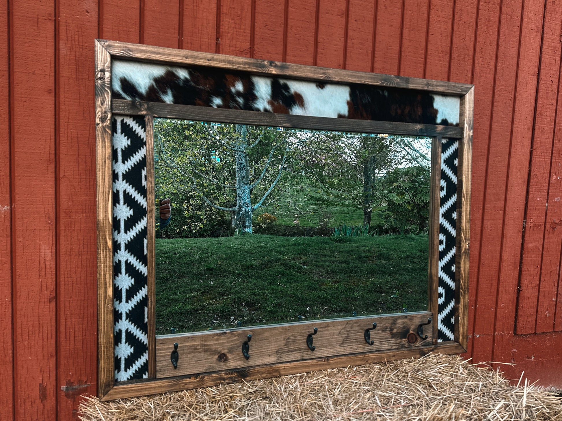 Cowhide framed mirror with hangers