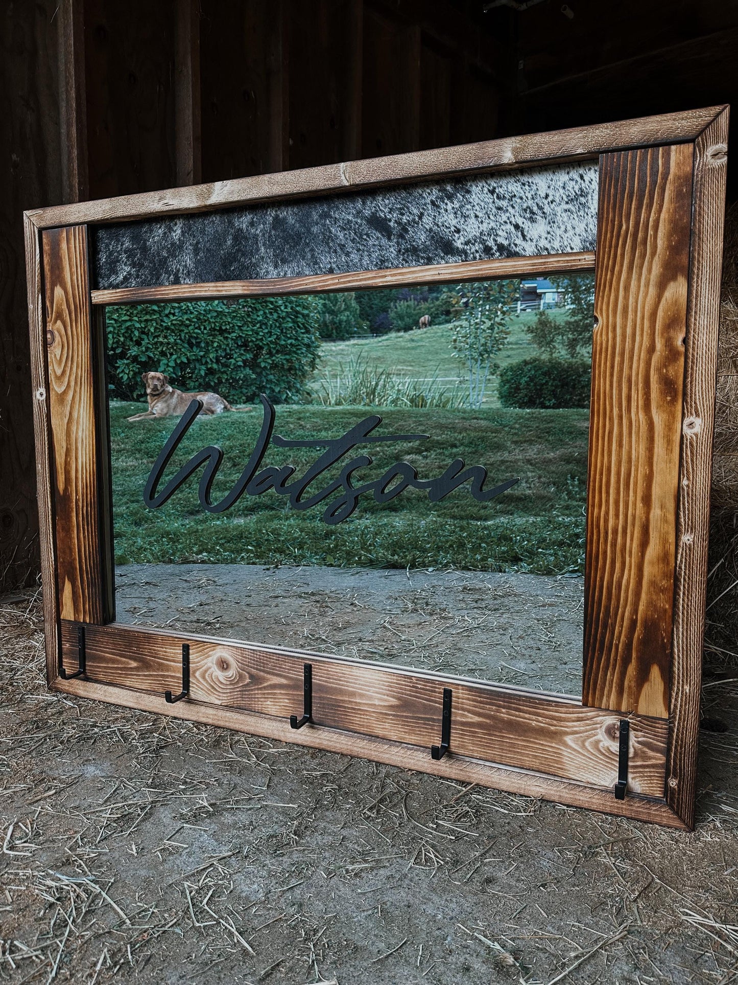 Cowhide framed mirror with hangers