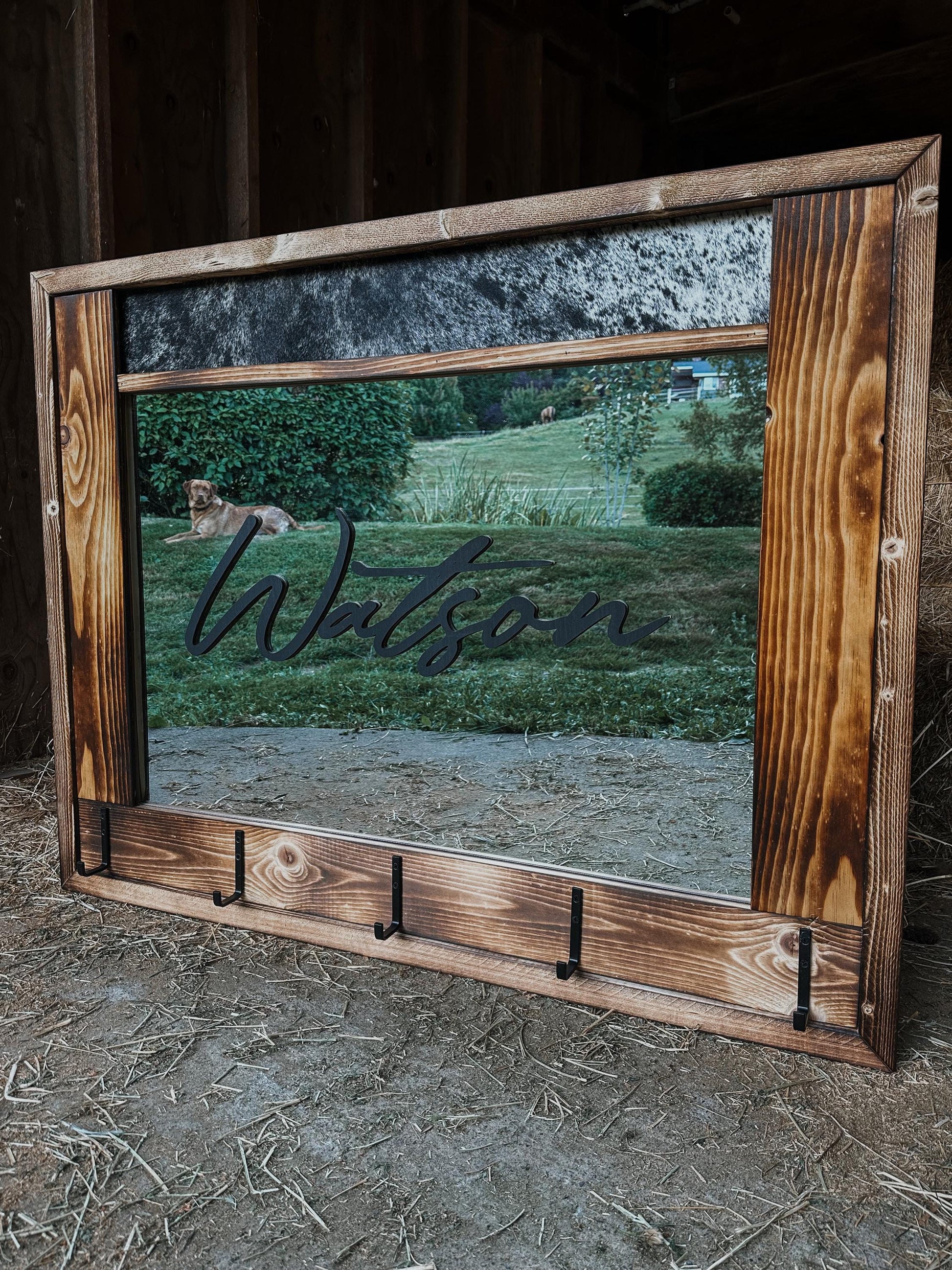 Cowhide framed mirror with hangers