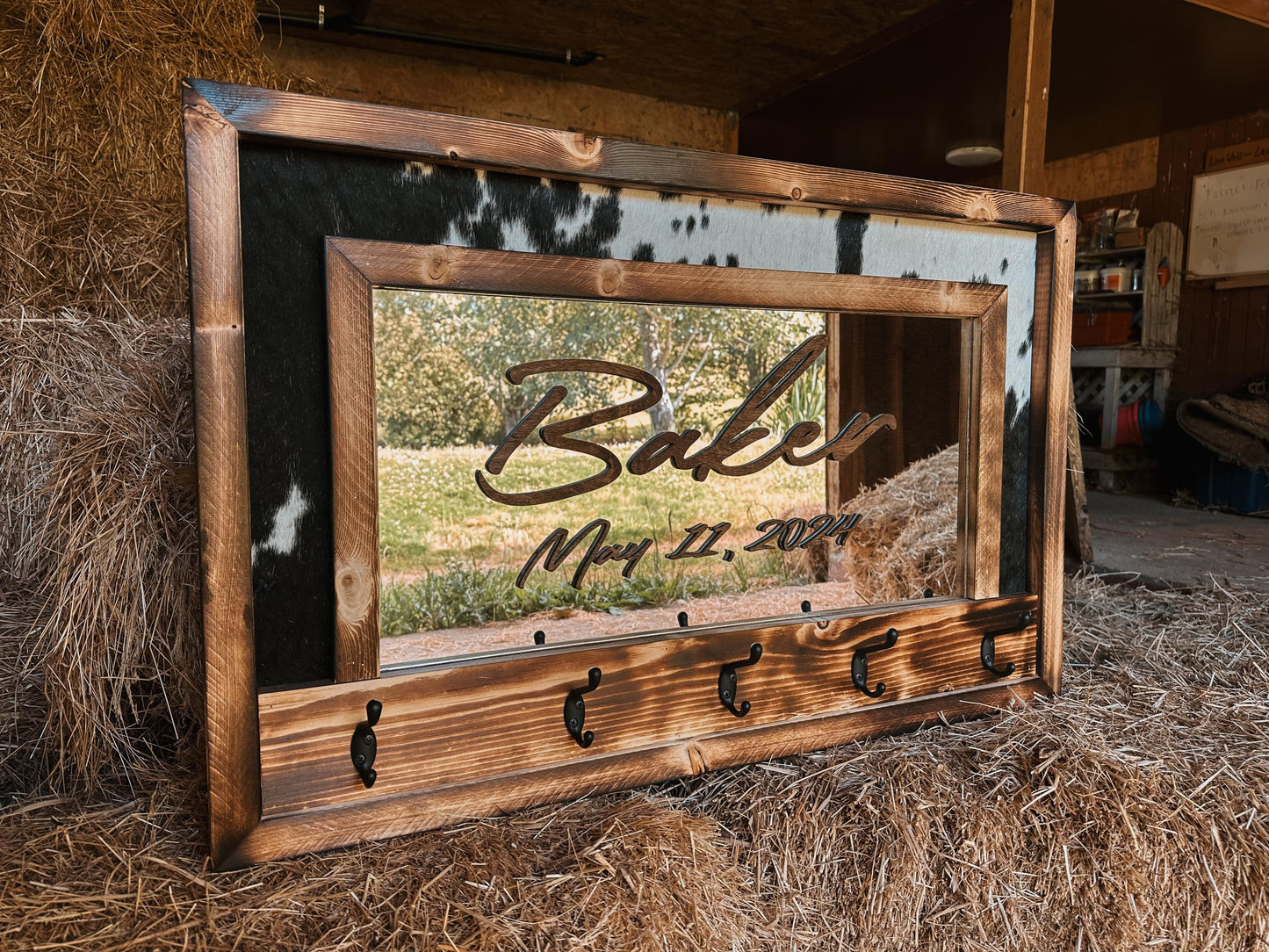 Cowhide framed mirror with hangers