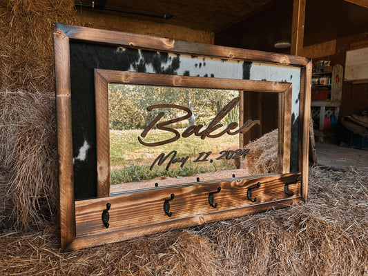 Cowhide framed mirror with hangers