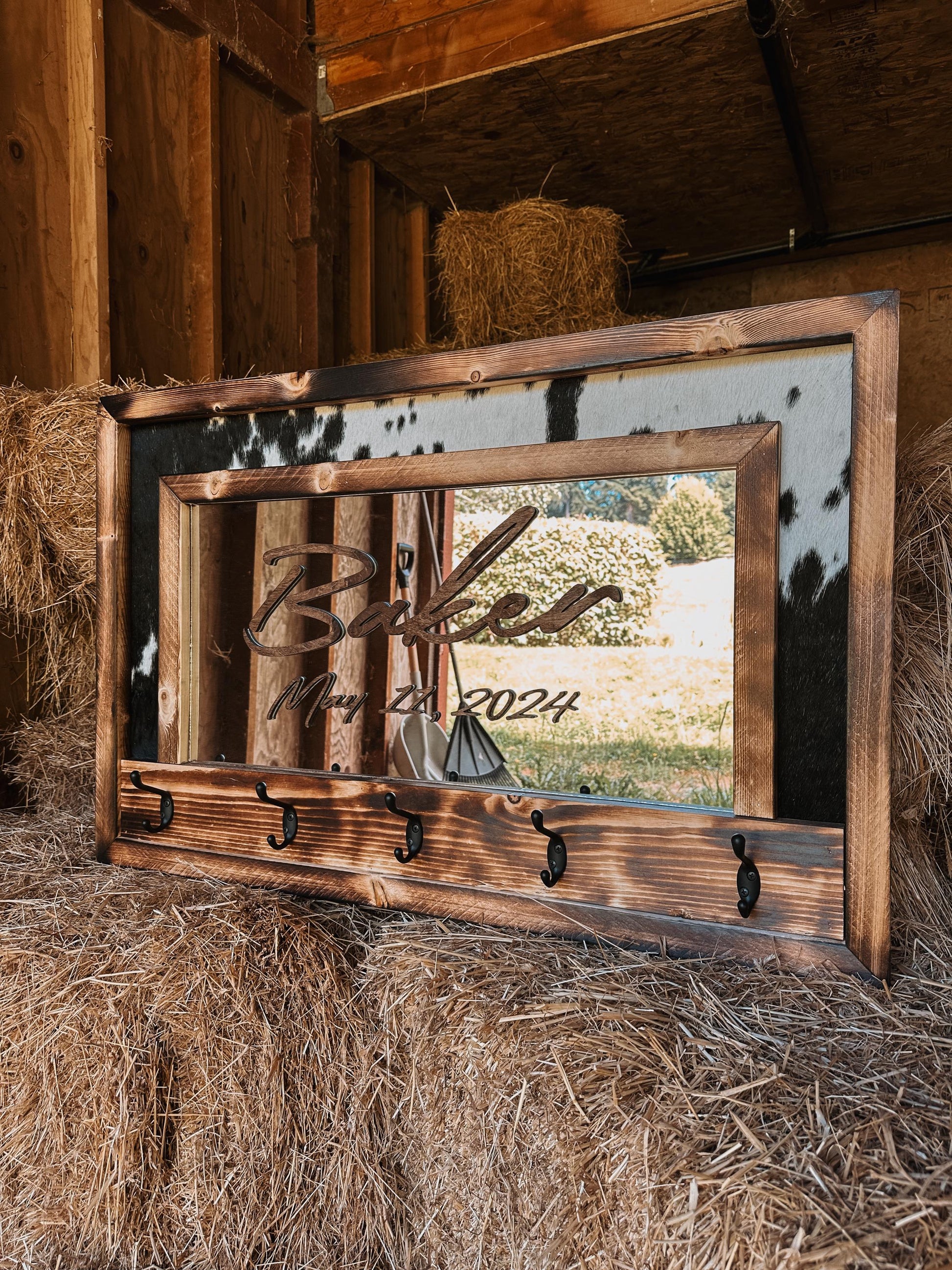 Cowhide framed mirror with hangers