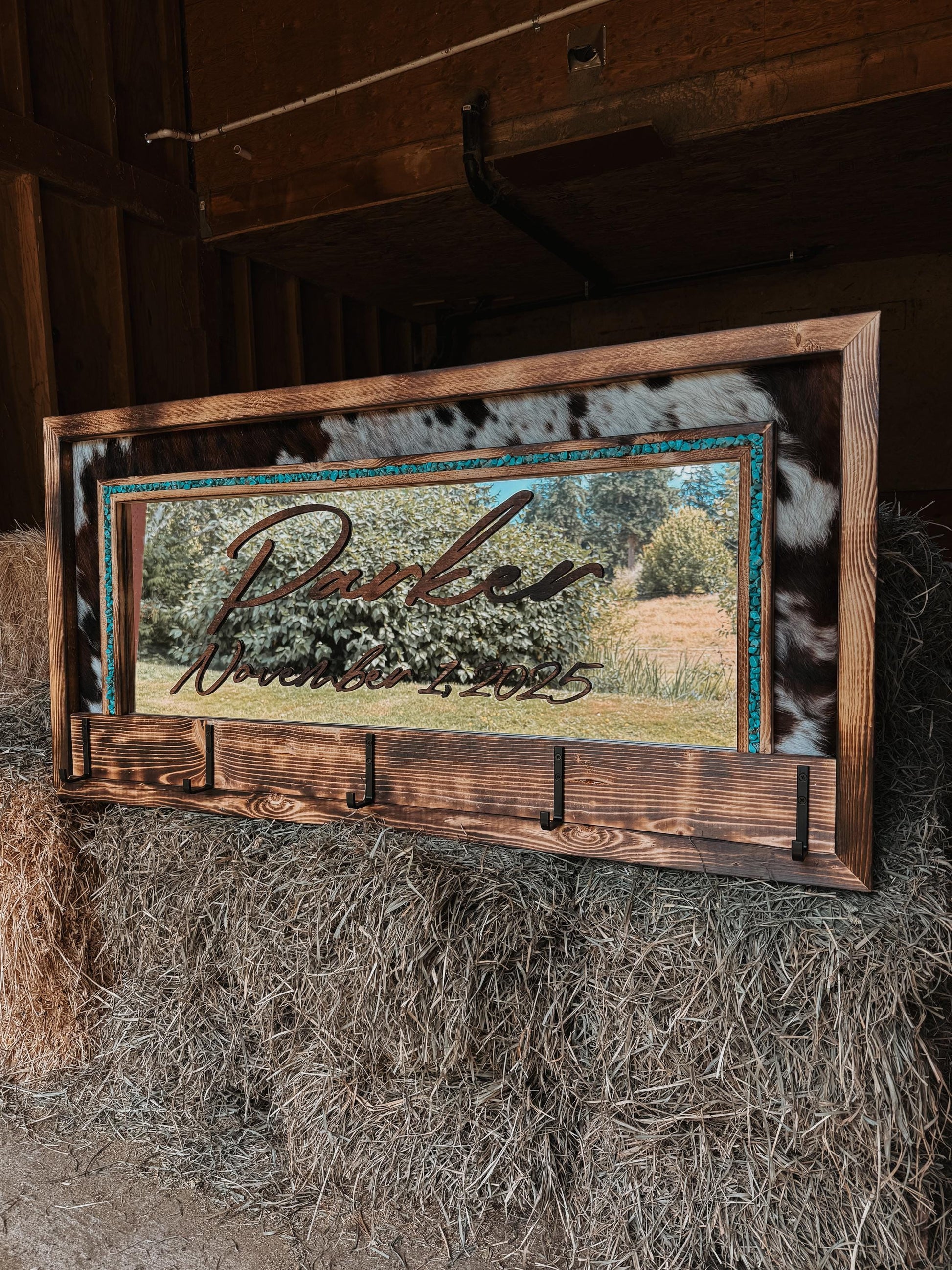 Cowhide framed mirror with hangers