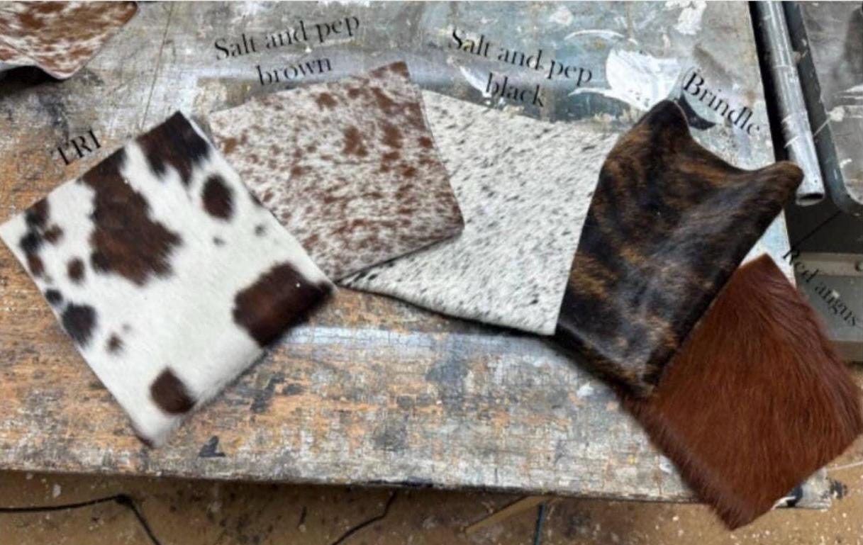 Cowhide framed mirror with hangers