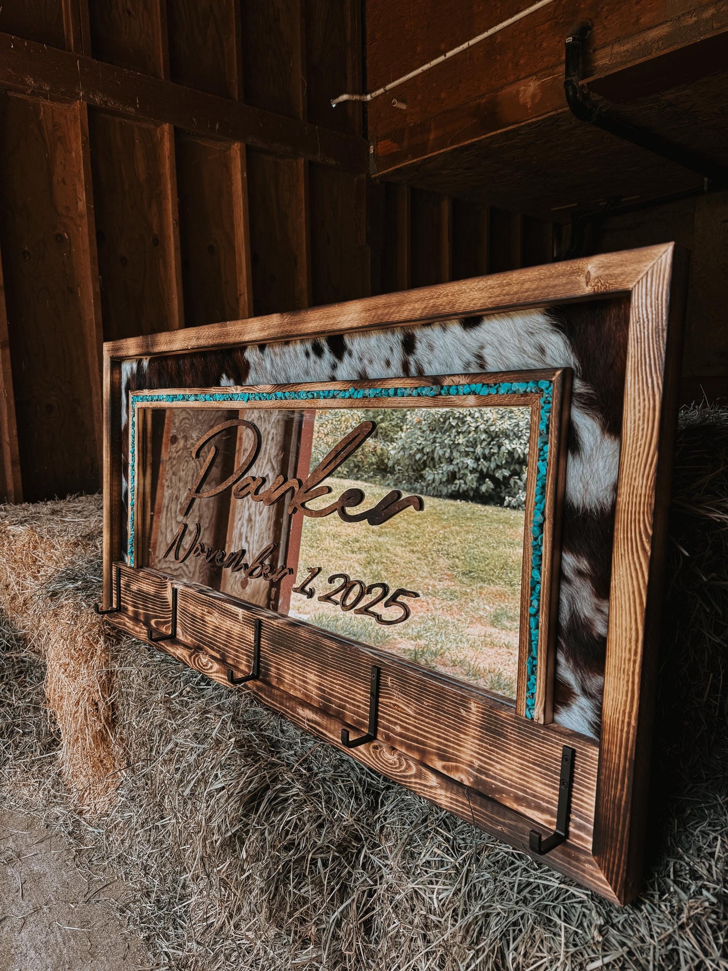 Cowhide framed mirror with hangers