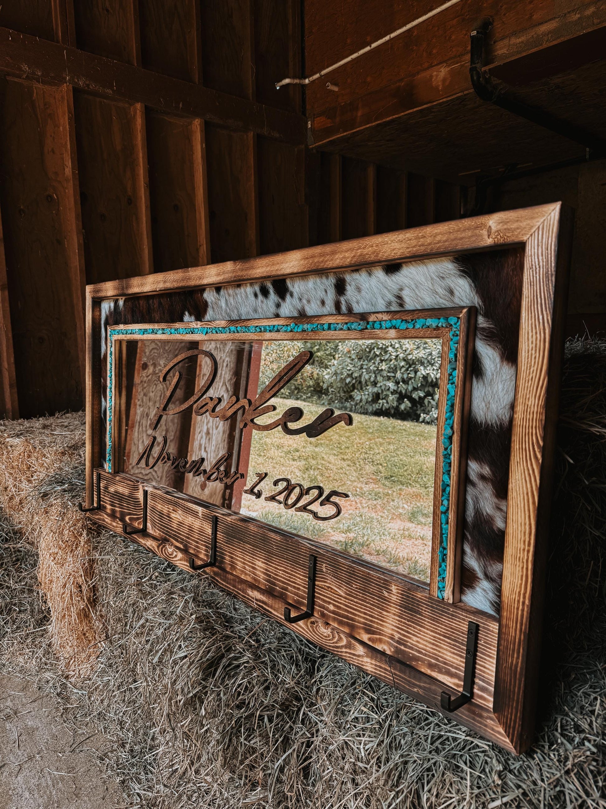 Cowhide framed mirror with hangers